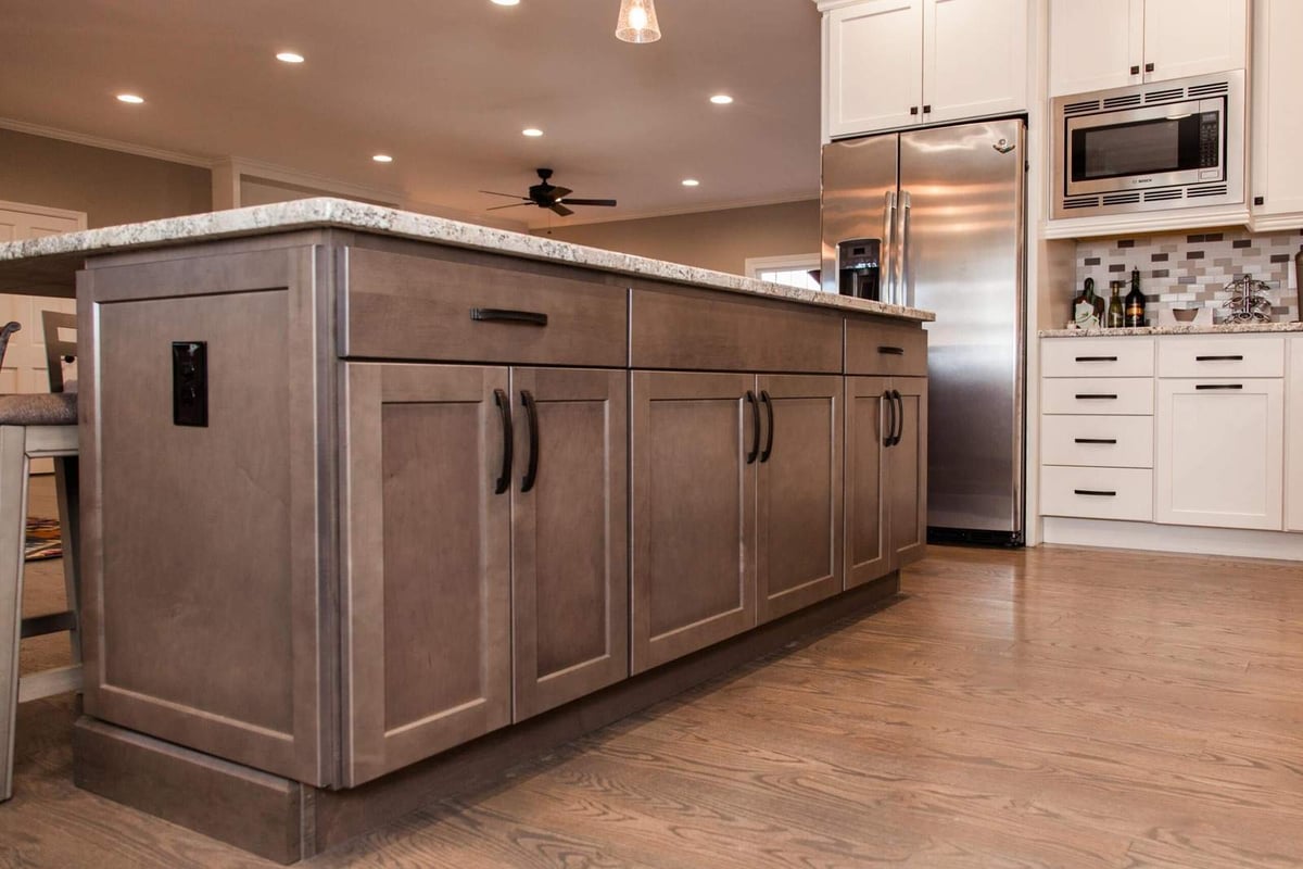 Shaker cabinets with black pulls built in kitchen island