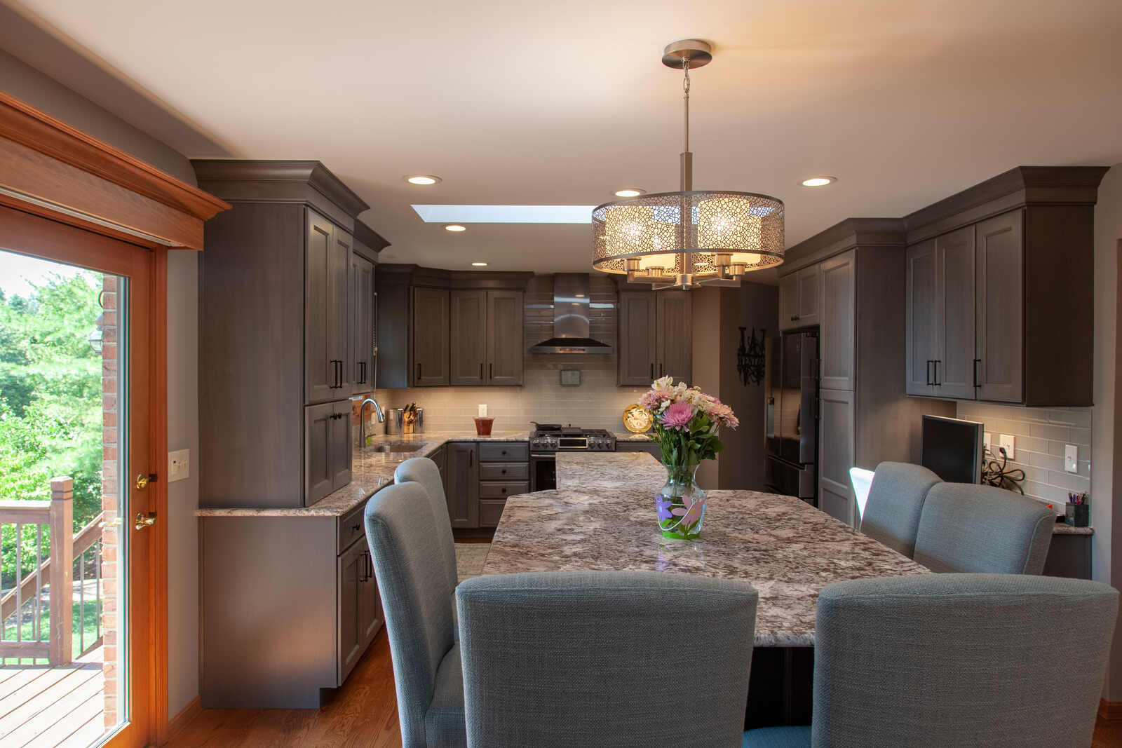 split level kitchen island with grey cabinets