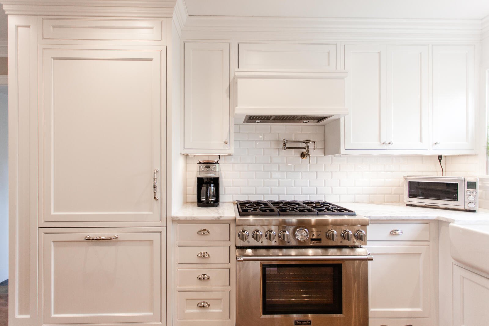 white kitchen with white subway tile backsplash