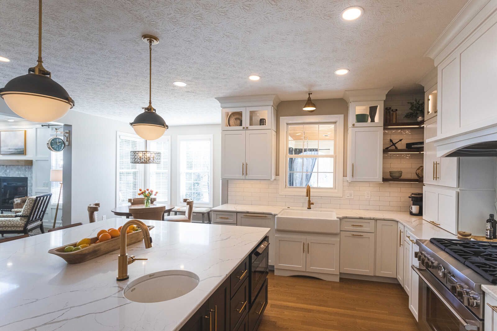 white subway tile backsplash with circular sink in kitchen island
